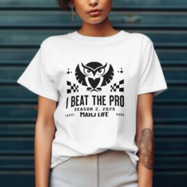 Person wearing a white T-shirt with a gaming-themed slogan and graphics.