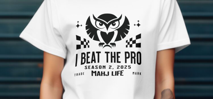 MPI AMJ Quest Rules Trek Experience Person wearing a white T-shirt with a gaming-themed slogan and graphics.