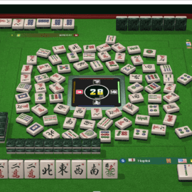 A Mahjong game in progress with tiles spread across the table.