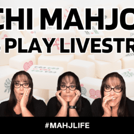 A woman excitedly prepares for a Mahjong livestream at home.